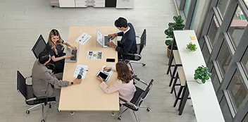 Group of people sitting at a conference table